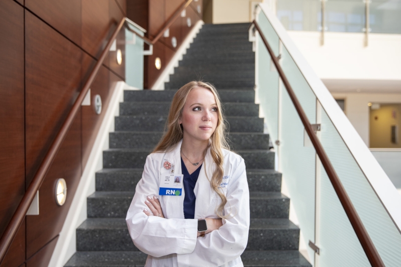 RN/Nurse standing in front of a staircase