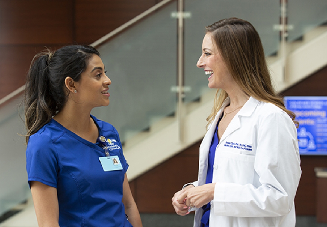 Two nurses talking to each other