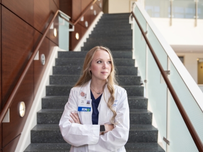 RN/Nurse standing in front of a staircase